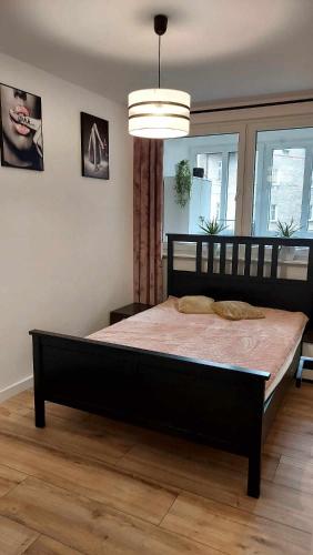 מיטה או מיטות בחדר ב-Apartament Iwona