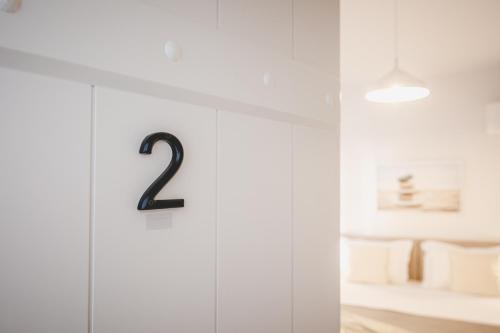 a white cabinet with a number on it at Votsalo Tolo in Tolo