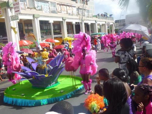 a group of people dressed in pink in a parade at Les Gîtes Kajou in Bouillante