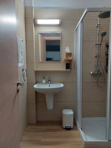 a bathroom with a sink and a shower at Milepost vacations in Paralimni