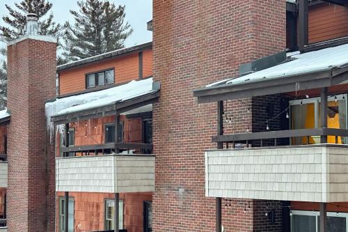 a red brick building with windows at Pico Mountain Perch, Unit B22 in Mendon