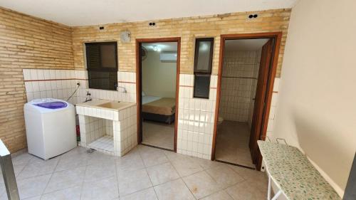 a small bathroom with a sink and a mirror at Aregua 1077 in Asunción