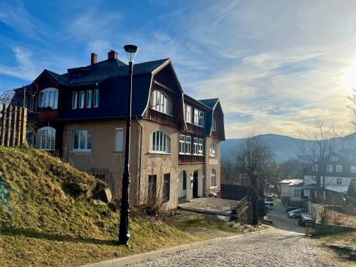 a house on the side of a hill at Apartament Lucjanek in Karpacz