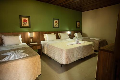 En eller flere senge i et værelse på Águas do Manso Hotel E Marina