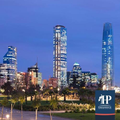 a city skyline at night with tall buildings at Hotel Presidente in Santiago
