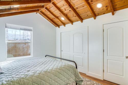 a bedroom with a bed and a window at Cedar City Studio Retreat Patio, Fire Pit and Grill in Cedar City