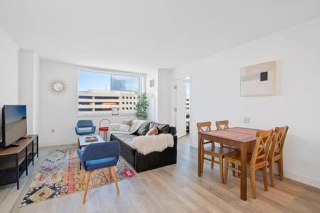 a living room with a table and a couch at CozySuites at Showboat Bold 2BR 3BA Beachfront in Atlantic City