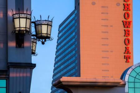 two street lights in front of a tall building at CozySuites at Showboat Bold 2BR 3BA Beachfront in Atlantic City
