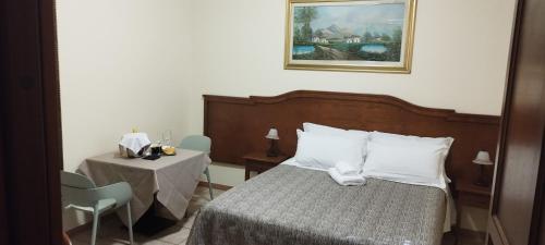 Postel nebo postele na pokoji v ubytování Hotel Colosseo Colleferro