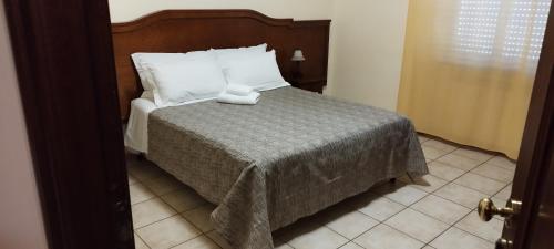 Postel nebo postele na pokoji v ubytování Hotel Colosseo Colleferro