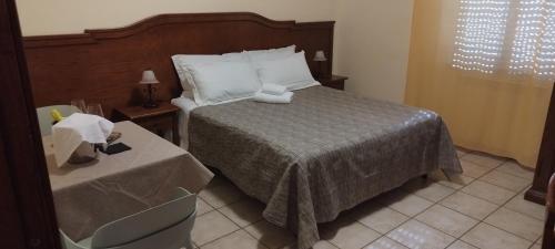 Postel nebo postele na pokoji v ubytování Hotel Colosseo Colleferro