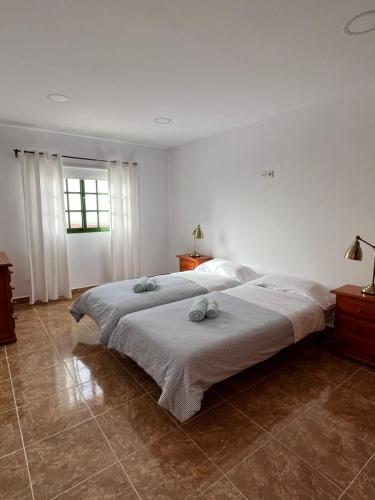 a bedroom with two beds with towels on them at Salobre Blue Sky 1 in Salobre