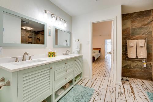 een badkamer met 2 wastafels en een douche bij Waterfront Haven Padre Island Home with Swim Spa! in Padre Island
