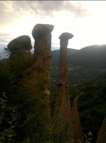 a group of mushroom formations on top of a mountain at Freddie house in Albiano
