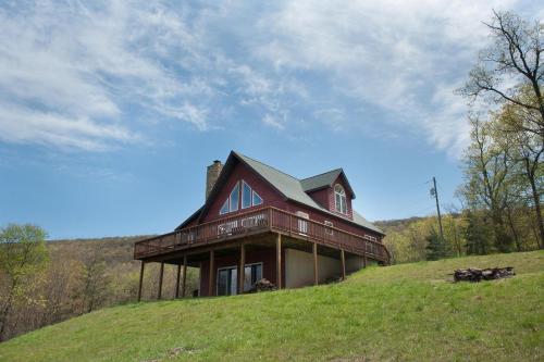 a large house on top of a hill at The Retreat at Upland Trail -Private 3BR in Berkeley Springs