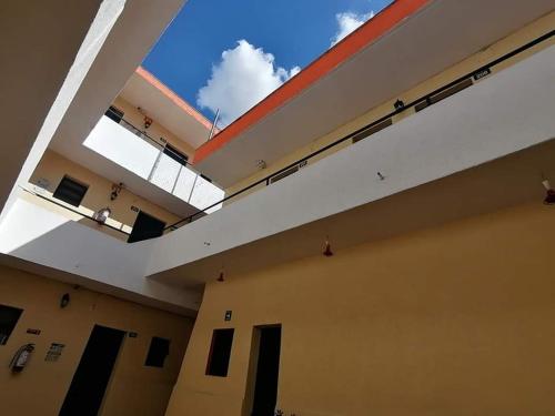 an empty building with a large open ceiling at Hotel Madrid Guadalajara in Guadalajara