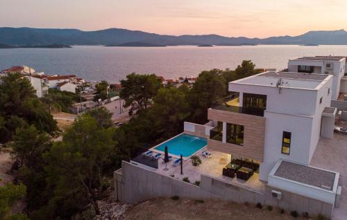 an aerial view of a house with a swimming pool at Villa Delux View in Komarna