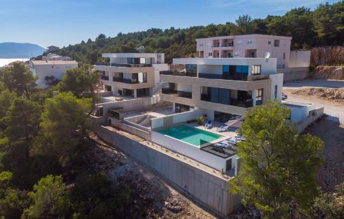 an aerial view of a house with a swimming pool at Villa Delux View in Komarna