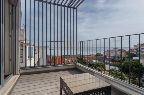 a balcony with a view of the ocean at Barbadinhos Apartments in Lisbon Historic Neighborhood in Lisbon
