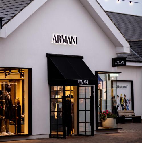 a store with a black awning on the side of a building at Luxurious 3 Bed House with Free Parking in Braintree, Close to the Train Station & City Centre in Braintree