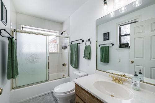 a bathroom with a sink and a shower and a toilet at Riverfront Bayfield Home with Deck and Gas Grill in Vallecito