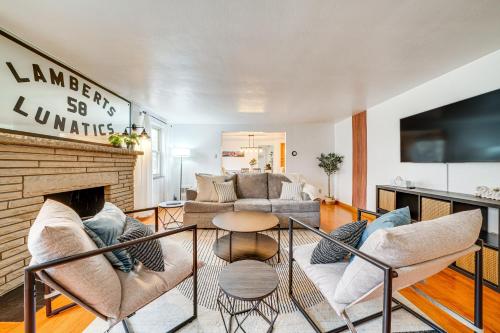 a living room with a couch and a fireplace at Spacious Pittsburgh Getaway about 2 Mi to Downtown! in Pittsburgh
