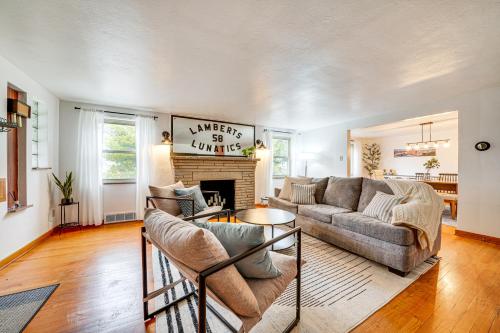 a living room with a couch and a fireplace at Spacious Pittsburgh Getaway about 2 Mi to Downtown! in Pittsburgh