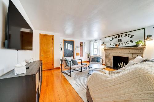 a living room with a couch and a fireplace at Spacious Pittsburgh Getaway about 2 Mi to Downtown! in Pittsburgh
