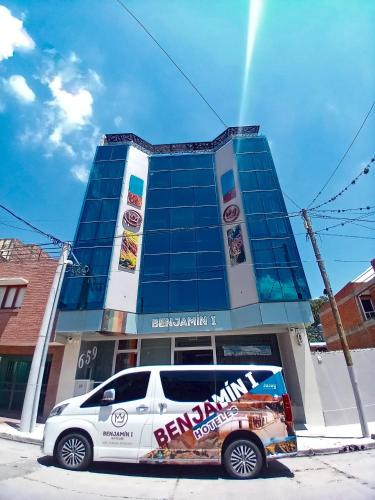 a white van parked in front of a building at Benjamín I in San Salvador de Jujuy