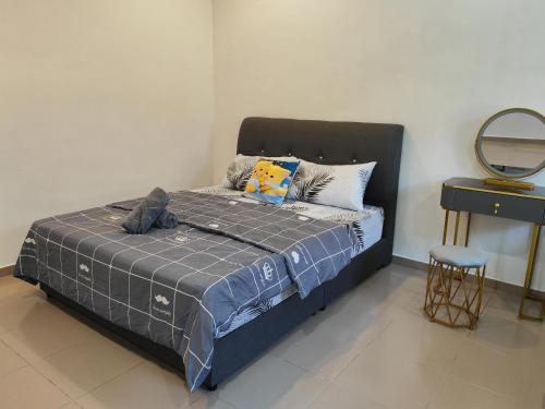 Кровать или кровати в номере Cozy Roomstay Padang Serai