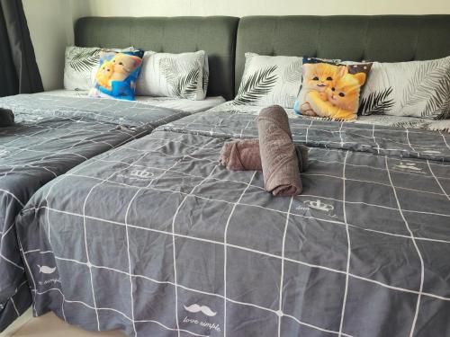 Кровать или кровати в номере Cozy Roomstay Padang Serai