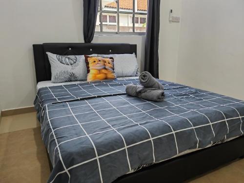 Кровать или кровати в номере Cozy Roomstay Padang Serai
