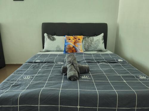 Кровать или кровати в номере Cozy Roomstay Padang Serai