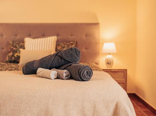 a stuffed animal laying on top of a bed at La Tejita Ocean Villa in Granadilla de Abona