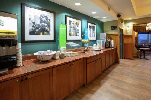 a pharmacyacist with a counter with food on it at Hampton Inn Duluth-Canal Park in Duluth