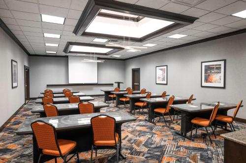 a conference room with tables and chairs in it at Hampton Inn Evansville Airport in Evansville