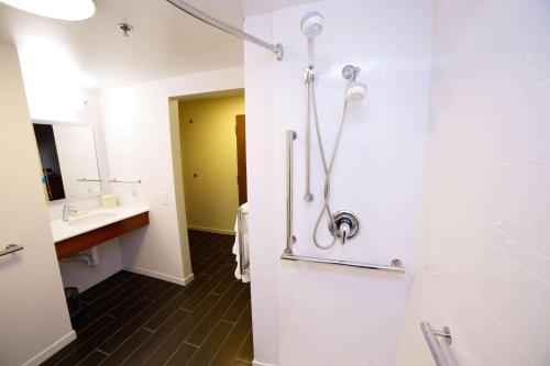 a bathroom with a shower and a sink at Hampton Inn Franklin, NC in Franklin
