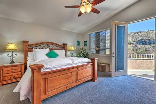a bedroom with a bed and a ceiling fan at Swim-Putt-Play! 5-BR Family Wonderland w/ Parking in Phoenix