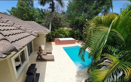 a swimming pool in the backyard of a house at 2 Bed 2 Bath Villa with Jacuzzi, High Speed Wi-Fi in Sosúa