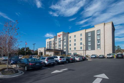 a parking lot with cars parked in front of a building at Hampton Inn Greenville/I-385 Haywood Mall, SC in Greenville