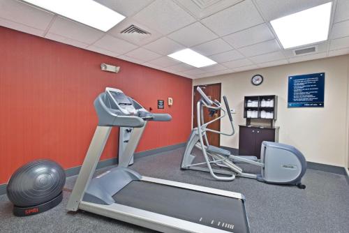 a gym with a treadmill and a exercise bike at Hampton Inn Huntington/Barboursville in Barboursville