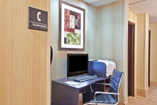 an office with a desk with a computer and a printer at Hampton Inn Huntington/Barboursville in Barboursville