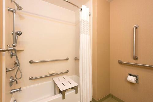 a bathroom with a shower and a toilet at Hampton Inn & Suites Crawfordsville in Crawfordsville