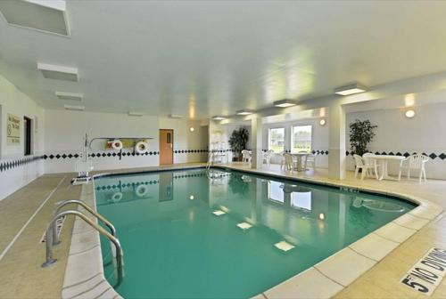 a large swimming pool in a large house at Hampton Inn Sturgis in Sturgis