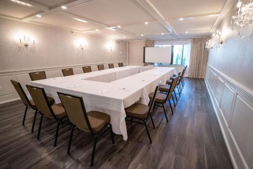 a large conference room with a white table and chairs at Hampton Inn & Suites Fairfield in Fairfield