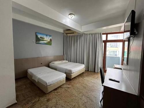 เตียงในห้องที่ Hotel HNS Manaus