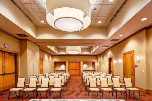 a room with rows of chairs and a chandelier at Embassy Suites by Hilton Houston-Energy Corridor in Houston