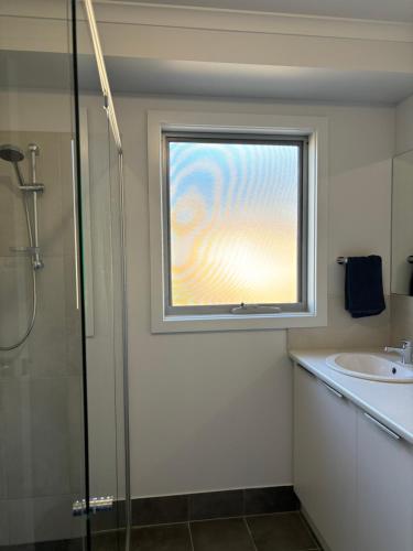 a bathroom with a window and a sink at Ocean Yakka, Kangaroo Island in Penneshaw