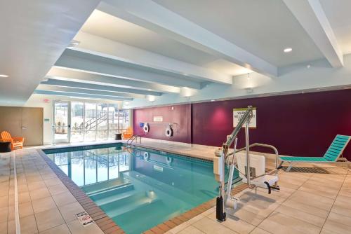 a large swimming pool in a large room with at Home2 Suites By Hilton Winston-Salem Hanes Mall in Winston-Salem