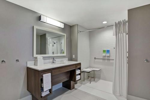a bathroom with a sink and a shower at Home2 Suites By Hilton Springdale in Springdale